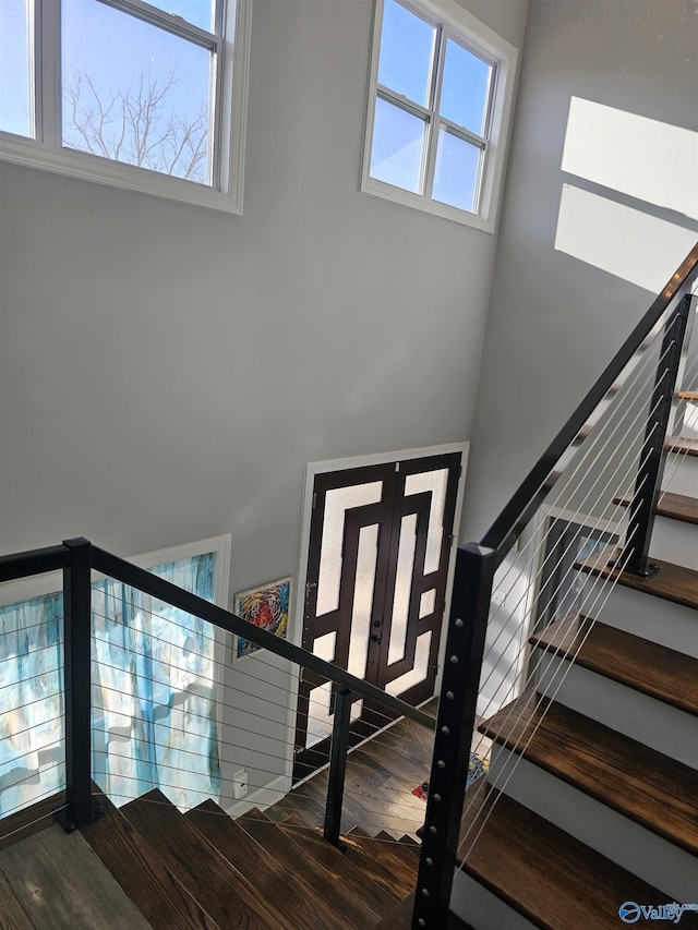 entrance foyer featuring hardwood / wood-style flooring and french doors