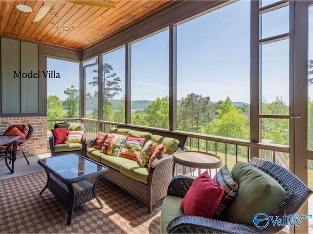 sunroom featuring wood ceiling and a wealth of natural light