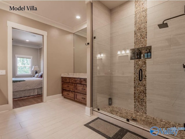 ensuite bathroom featuring crown molding, baseboards, a stall shower, and ensuite bathroom