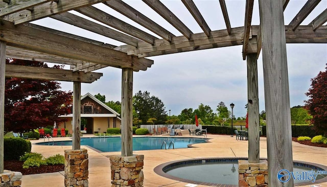 view of swimming pool with a patio and a pergola