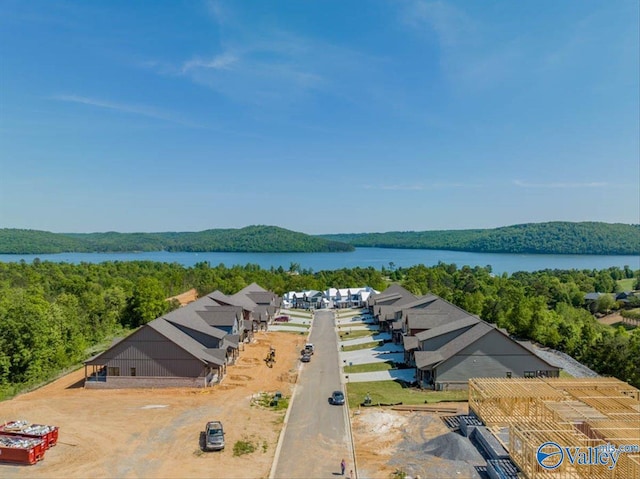 bird's eye view featuring a view of trees and a water view