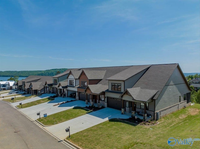 birds eye view of property with a residential view