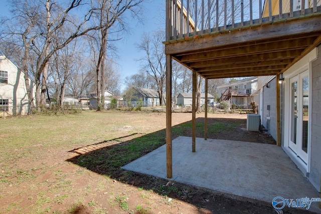 view of yard with a residential view, a patio, and fence