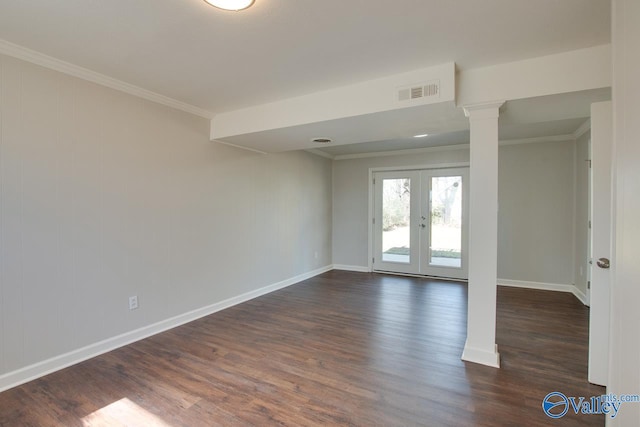 empty room with visible vents, french doors, crown molding, and ornate columns