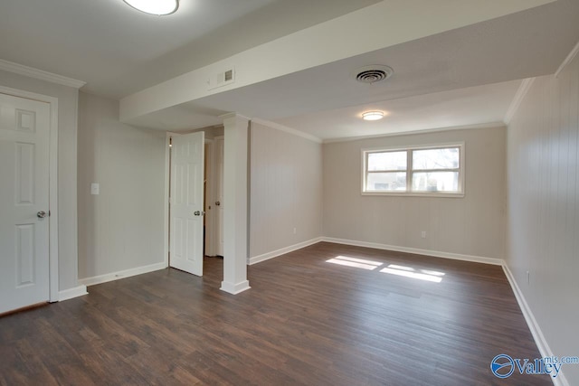 interior space with visible vents, dark wood-type flooring, and ornamental molding