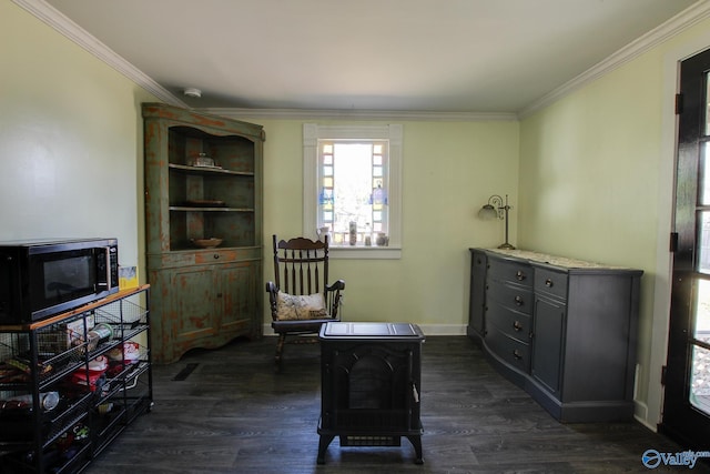 living area featuring dark hardwood / wood-style flooring and ornamental molding
