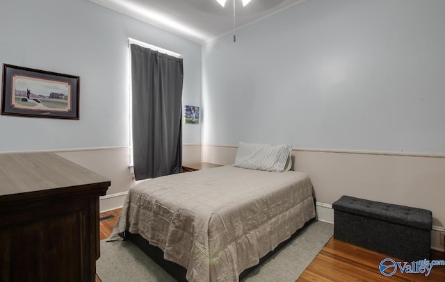 bedroom with hardwood / wood-style floors