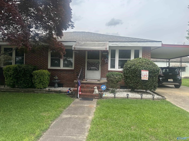 220 E Walnut St, Gadsden, AL 35903 - bungalow-style house with brick siding, a carport, and a front yard