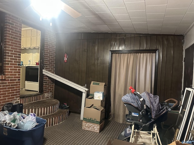 220 E Walnut St, Gadsden, AL 35903 - living area featuring carpet floors and wood walls