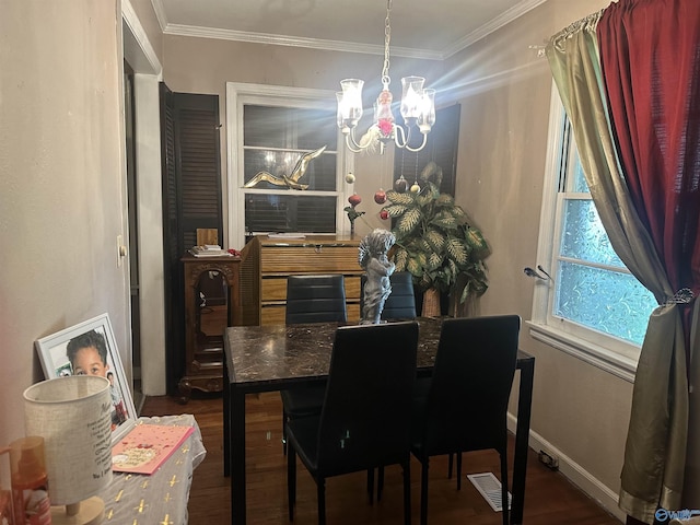 220 E Walnut St, Gadsden, AL 35903 - dining room featuring a chandelier, wood finished floors, ornamental molding, and baseboards