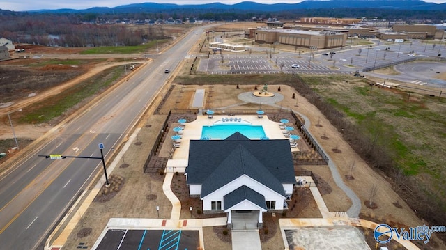 bird's eye view of a mountainous background and a pool