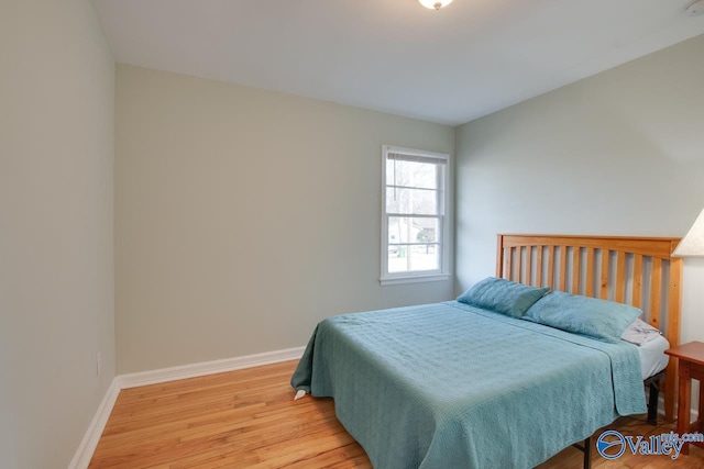 1608 Humes Ave, Huntsville, AL 35801 - bedroom featuring baseboards and light wood finished floors