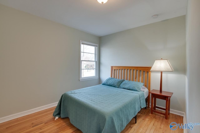 1608 Humes Ave, Huntsville, AL 35801 - bedroom with baseboards and light wood finished floors