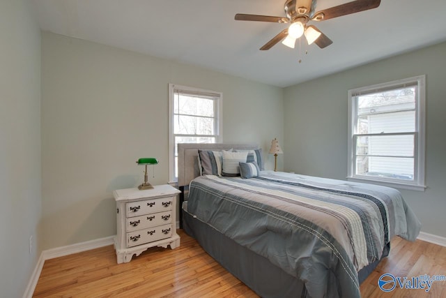 1608 Humes Ave, Huntsville, AL 35801 - bedroom with baseboards, a ceiling fan, and light wood-style flooring