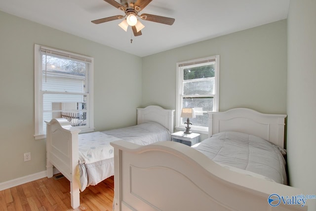 1608 Humes Ave, Huntsville, AL 35801 - bedroom with baseboards, ceiling fan, and light wood finished floors