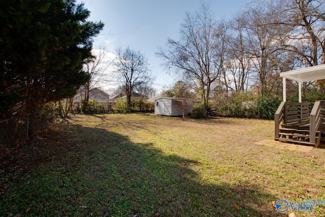 1608 Humes Ave, Huntsville, AL 35801 - view of yard with an outdoor structure and a storage shed