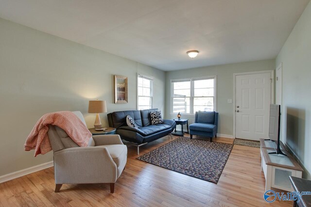 1608 Humes Ave, Huntsville, AL 35801 - living area with baseboards and light wood finished floors