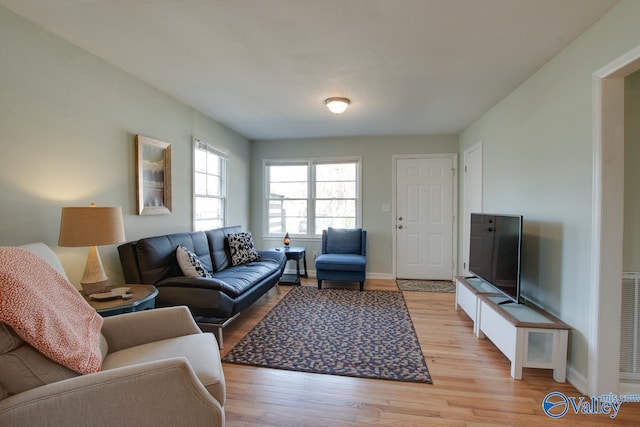 1608 Humes Ave, Huntsville, AL 35801 - living room featuring light wood-type flooring, baseboards, and visible vents