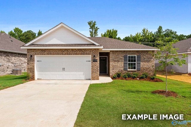 view of front of home featuring a garage, central AC, and a front lawn