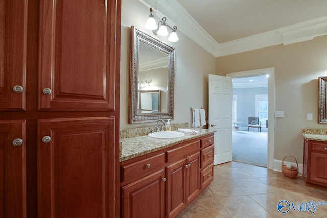 bathroom with ornamental molding, tile patterned floors, and vanity