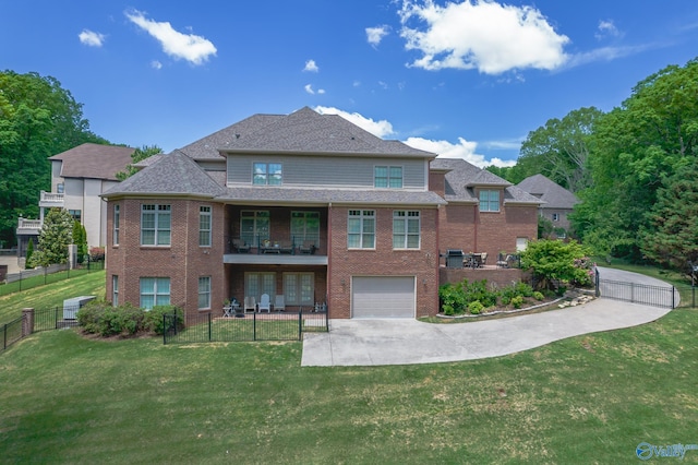 exterior space with a garage and a lawn