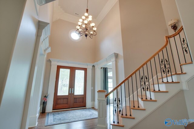 dining space featuring light hardwood / wood-style flooring, a notable chandelier, and a healthy amount of sunlight