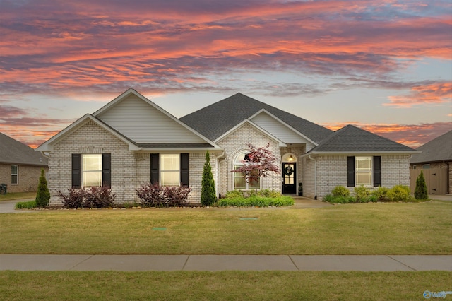 17067 Stonegate Dr, Athens, AL 35613 - ranch-style home with a lawn, brick siding, and roof with shingles