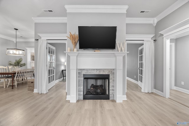 17067 Stonegate Dr, Athens, AL 35613 - living room with wood finished floors, visible vents, a fireplace, and ornamental molding