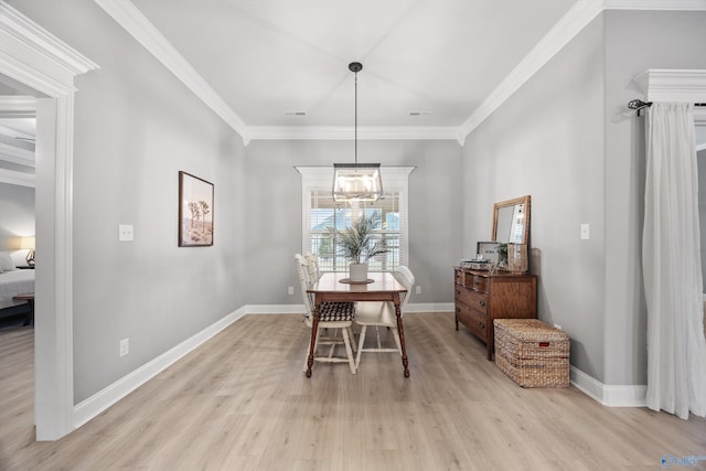 17067 Stonegate Dr, Athens, AL 35613 - dining area with baseboards, crown molding, a chandelier, and light wood-style floors