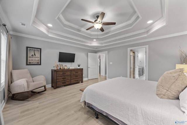 17067 Stonegate Dr, Athens, AL 35613 - bedroom with a tray ceiling, light wood-style flooring, visible vents, and crown molding