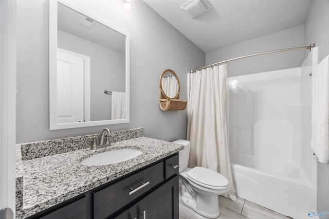 17067 Stonegate Dr, Athens, AL 35613 - full bathroom featuring toilet, shower / bath combo with shower curtain, vanity, and visible vents