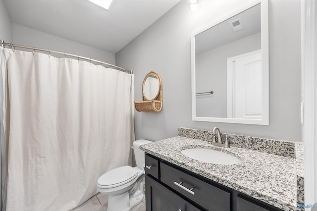 17067 Stonegate Dr, Athens, AL 35613 - bathroom with toilet, vanity, and visible vents