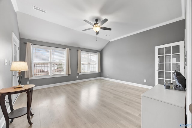 17067 Stonegate Dr, Athens, AL 35613 - unfurnished living room featuring lofted ceiling, visible vents, light wood-type flooring, baseboards, and ceiling fan