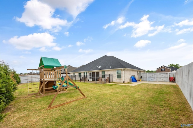 17067 Stonegate Dr, Athens, AL 35613 - exterior space with a gate, a lawn, and a fenced backyard