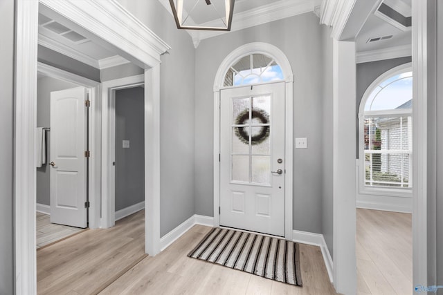 17067 Stonegate Dr, Athens, AL 35613 - entrance foyer with plenty of natural light, light wood-style floors, and ornamental molding