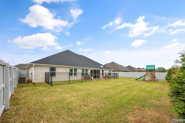 17067 Stonegate Dr, Athens, AL 35613 - exterior space with a fenced backyard, brick siding, a yard, and a playground