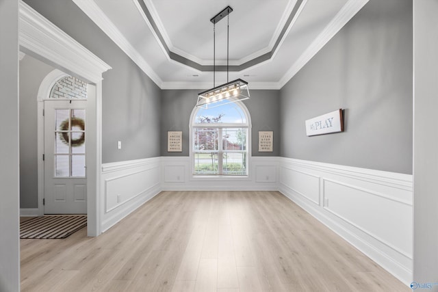 17067 Stonegate Dr, Athens, AL 35613 - unfurnished dining area with wainscoting, a notable chandelier, wood finished floors, crown molding, and a raised ceiling