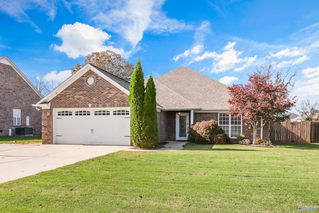 view of front of property featuring central AC unit, a garage, and a front lawn