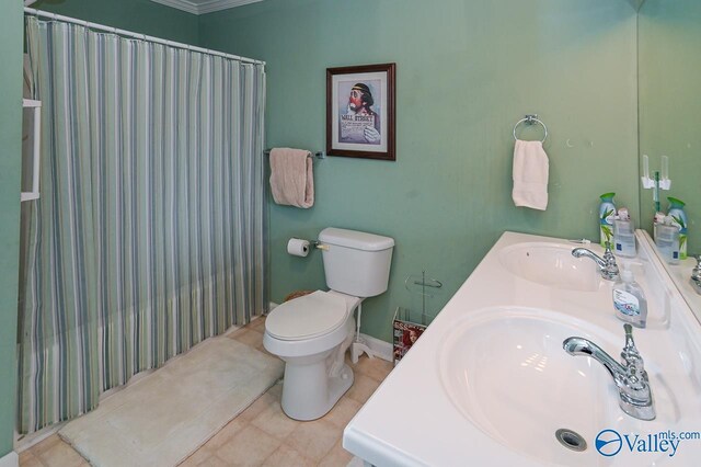 bathroom featuring vanity, toilet, ornamental molding, and a shower with shower curtain