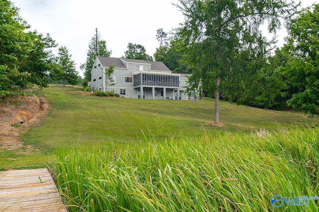 rear view of house with a yard