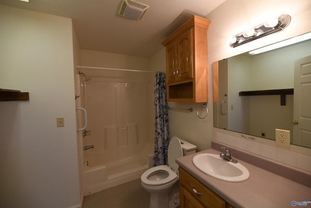 full bathroom featuring vanity, shower / tub combo, and toilet