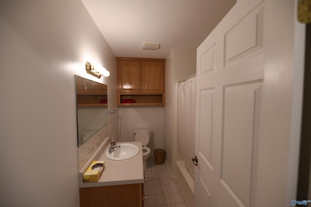 bathroom with tile patterned flooring, vanity, a shower with curtain, and toilet