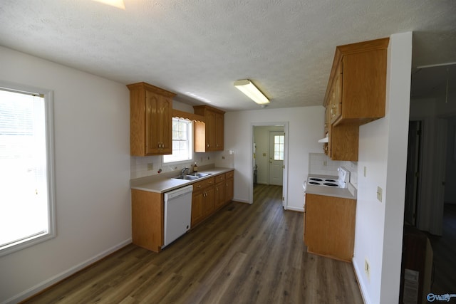 kitchen with sink, tasteful backsplash, a textured ceiling, dark hardwood / wood-style flooring, and white appliances