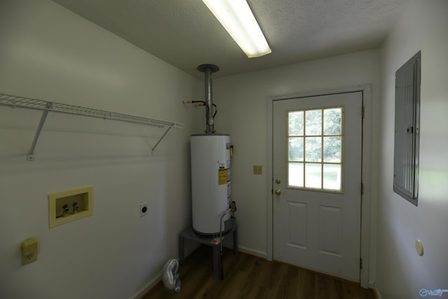 washroom with water heater, dark hardwood / wood-style floors, washer hookup, a textured ceiling, and hookup for an electric dryer