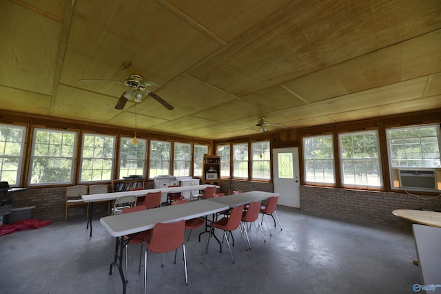 sunroom featuring cooling unit, wood ceiling, and ceiling fan