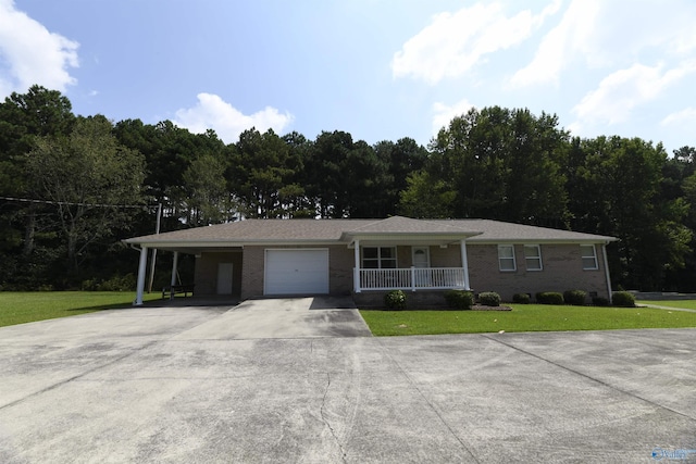 ranch-style home featuring a garage, a front lawn, a carport, and a porch