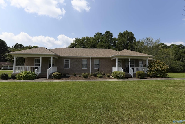 single story home with covered porch and a front lawn