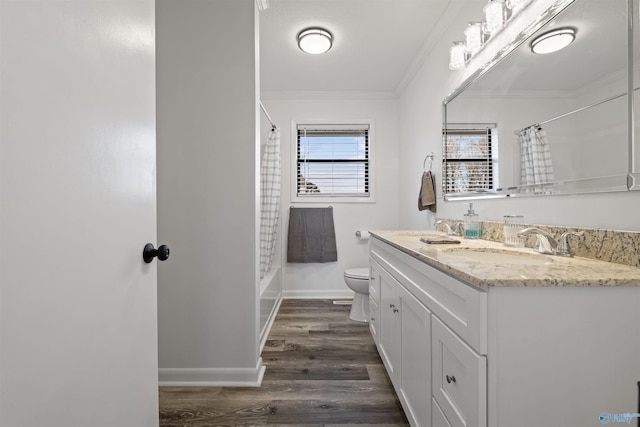 615 County Road 40, Centre, AL 35960 - full bath featuring crown molding, double vanity, toilet, wood finished floors, and a sink