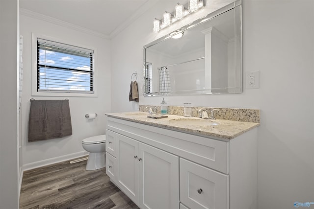 615 County Road 40, Centre, AL 35960 - bathroom featuring toilet, ornamental molding, baseboards, a sink, and wood finished floors