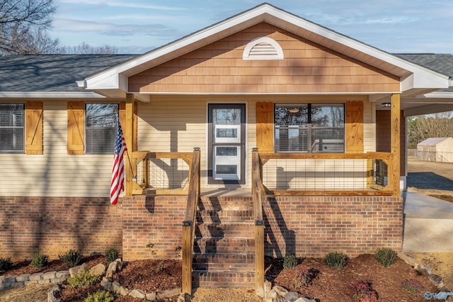 615 County Road 40, Centre, AL 35960 - view of front facade with stairs, a porch, and roof with shingles